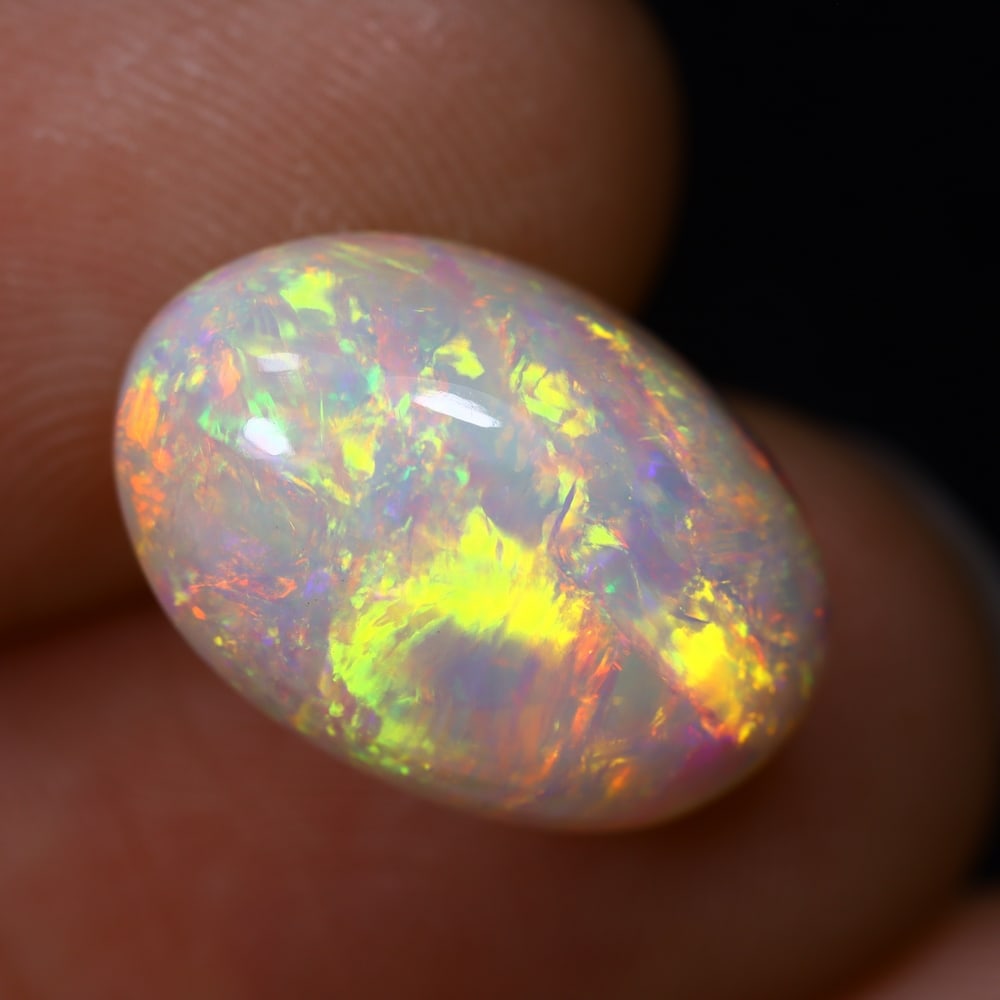6.43Ct Welo Opal Polished - Ethiopian Opal, 709B: ThousandPlanet Auction Subject: Natural Ethiopian Welo Opal Origin: Ethiopia Carat Weight: 6.43Ct Dimension: 15.5x10.4x7.6 mm Treatment: Natural Untreated Type: Cabochon, Polis