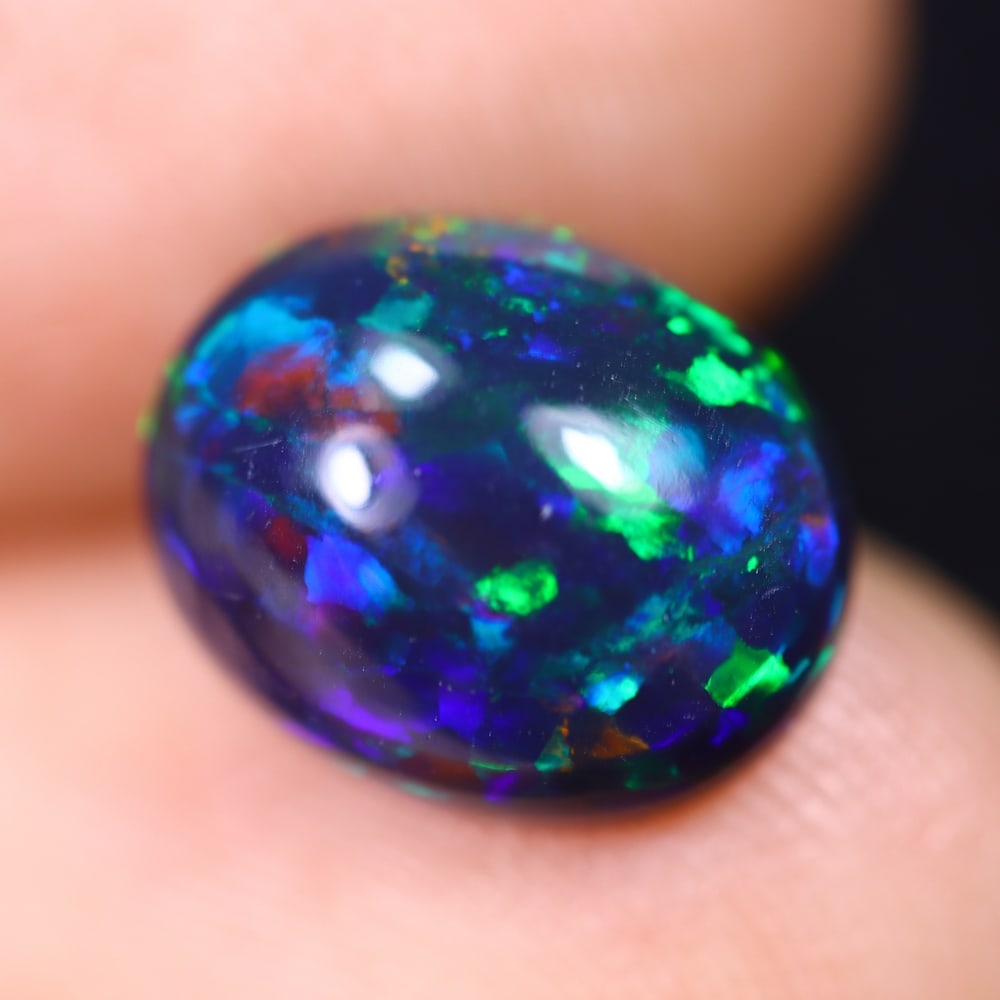 2.29Ct Welo Black Opal Polished - Ethiopian Opal , 359E: ThousandPlanet Auction Subject: Natural Ethiopian Welo Black Opal Origin: Ethiopia Carat Weight: 2.29Ct Dimension: 11.1x9x4.5 mm Treatment: Smoked Type: Cabochon, Polished