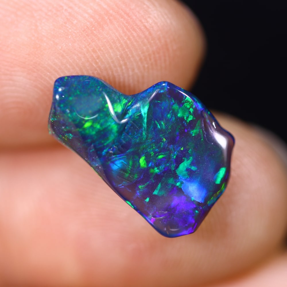 *2.05Ct Smoked Freeform Welo Opal Polished - Ethiopian Opal , 208C: ThousandPlanet Auction Subject: Natural Ethiopian Welo Opal Origin: Ethiopia Carat Weight: 2.05Ct Dimension: 15.4x9.5x4.1 mm Treatment: Smoked Type: Freeform, Polished