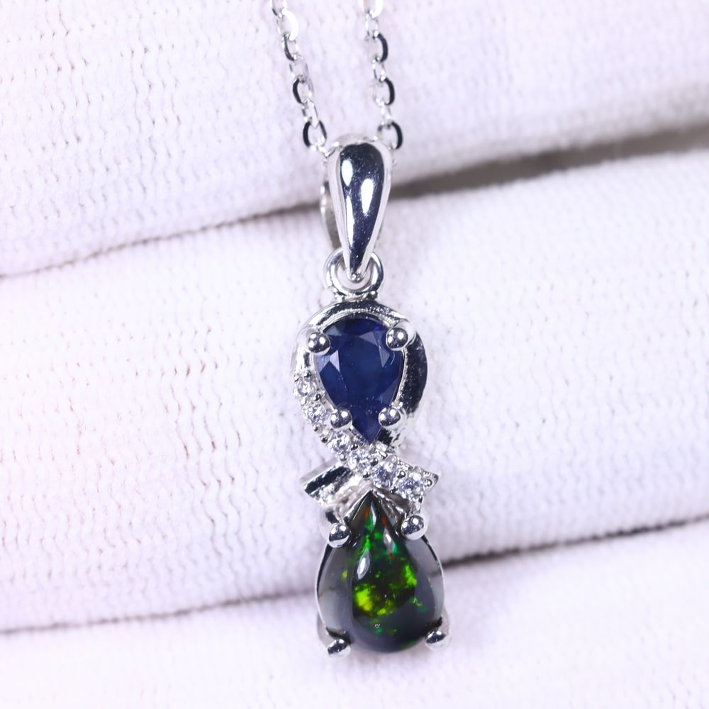Necklace 18inches Black Opal & Sapphire - 925 Sterling Silver , 721E: ThousandPlanet Auction Subject: Natural Black Opal & Sapphire Origin: Thailand Carat Weight: 2.98g Dimension: Gemstone 6x8mm Type: Necklace