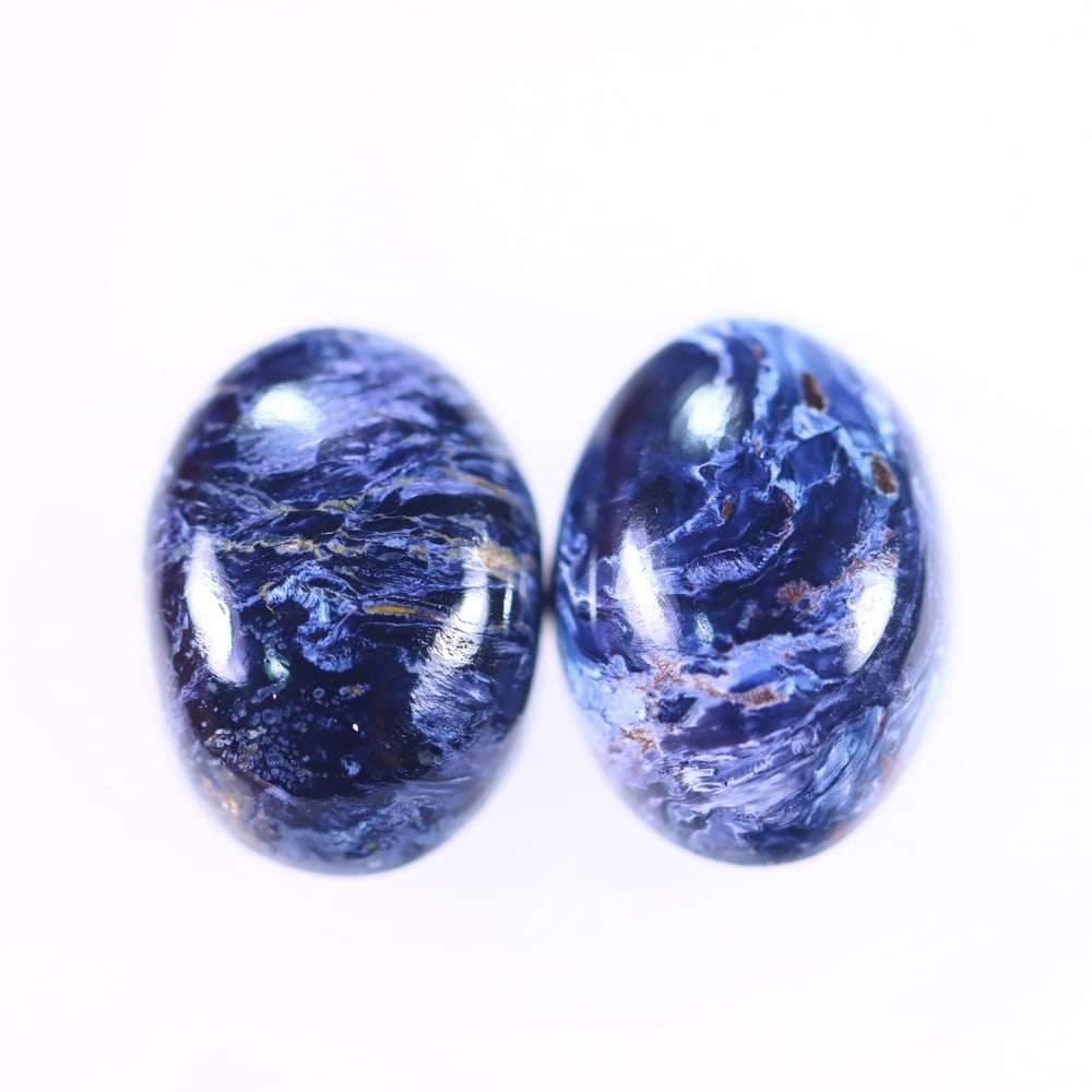 11.19Ct Pietersite Cabochon Pair - Gemstone Crystal - Oval Cabochon, 351B: ThousandPlanet Auction Subject: Natural Pietersite Origin: Namibia, South Africa Carat Weight: 11.19Ct Dimension: 14 x 10.2 x 4.9 mm Treatment: Natural Untreated Shape: Oval