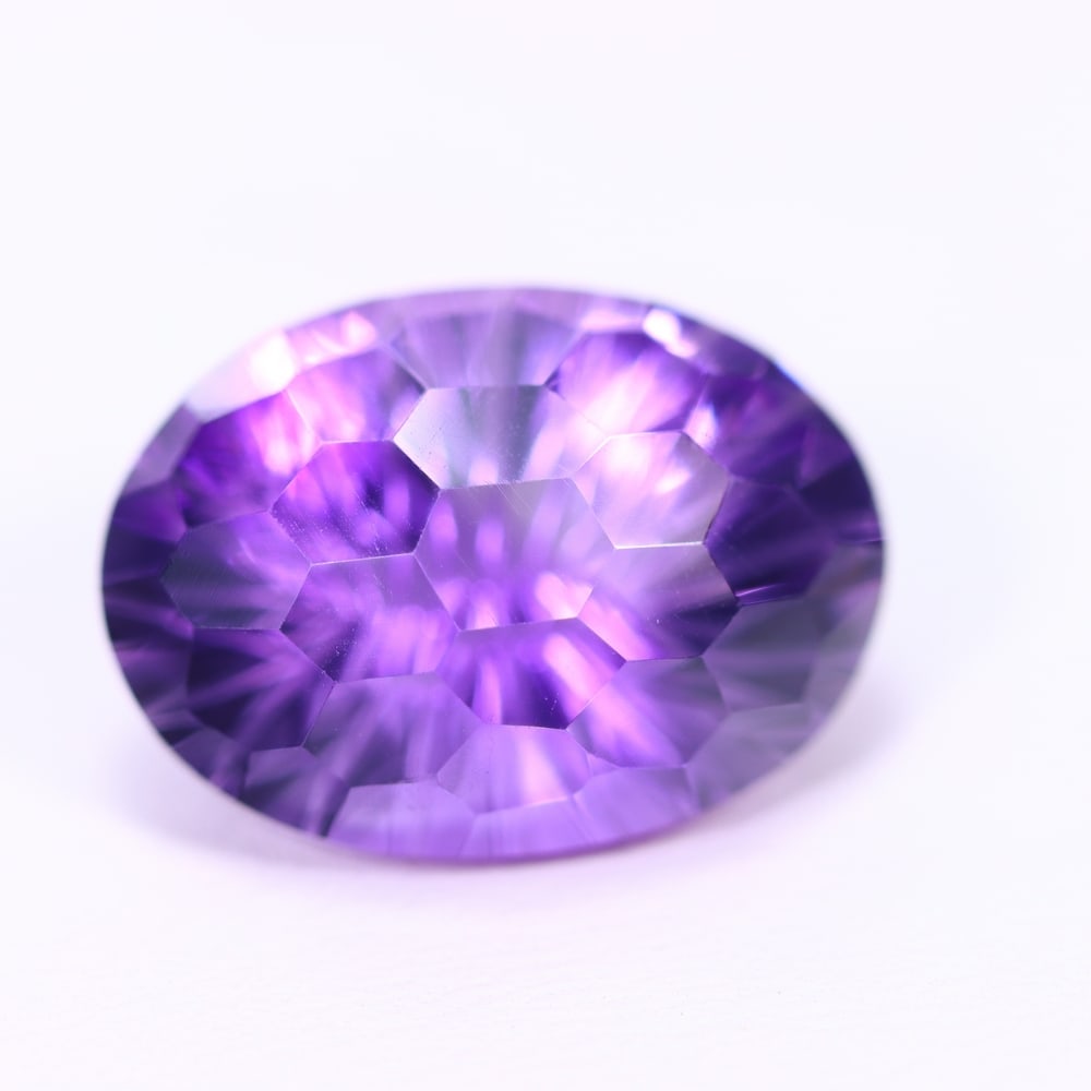 16.34Ct Purple Amethyst - Polished Faceted, 1124B: ThousandPlanet Auction Subject: Natural Amethyst Origin: Brazil Carat Weight: 16.34Ct Dimension: 19.3x14.1x11.4 mm Treatment: Untreated Type: Faceted, Polished