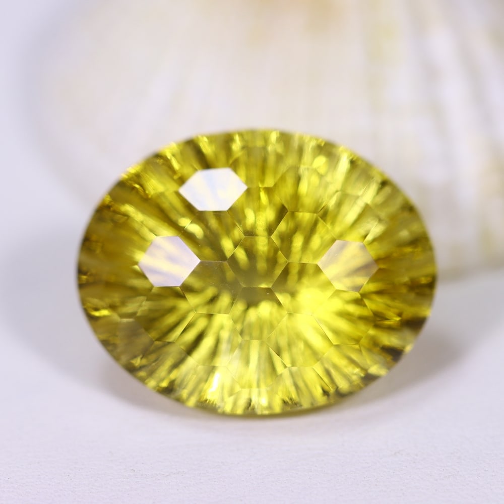 21.45Ct Citrine - Special Cut - Faceted Polished , 877E: ThousandPlanet Auction Subject: Natural Citrine Origin: Brazil Carat Weight: 21.45Ct Dimension: 21.6x17.3x12 mm Treatment: Untreated Type: Faceted, Polished