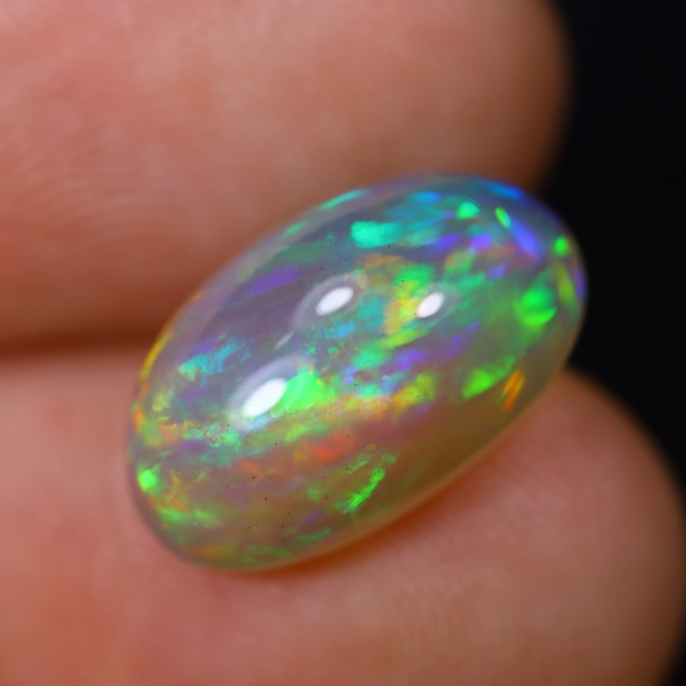 *5.14Ct Welo Opal Polished - Ethiopian Opal, 1159B: ThousandPlanet Auction Subject: Natural Ethiopian Welo Opal Origin: Ethiopia Carat Weight: 5.14Ct Dimension: 15.2x9.3x6.8 mm Treatment: Natural Untreated Type: Cabochon, Polish