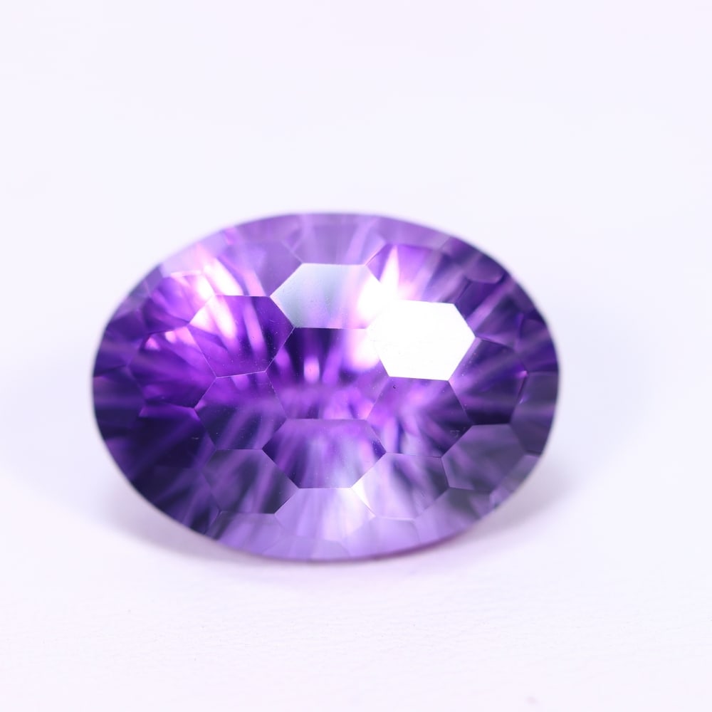 12.87Ct Purple Amethyst - Polished Faceted , 834E: ThousandPlanet Auction Subject: Natural Amethyst Origin: Brazil Carat Weight: 12.87Ct Dimension: 17/6x13.1x10.8 mm Treatment: Untreated Type: Faceted, Polished