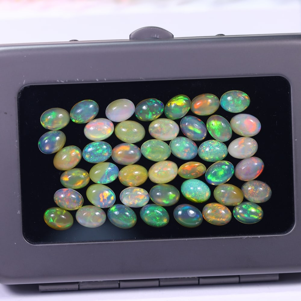 *20.90Ct Calibrated 7x5mm Welo Opal Set - Ethiopian Opal, 278B: ThousandPlanet Auction Subject: Natural Ethiopian Welo Opal Origin: Ethiopia Carat Weight: 20.90Ct Dimension: 7.1x5.2x4 mm Treatment: Natural Untreated Type: Cabochon, Polished