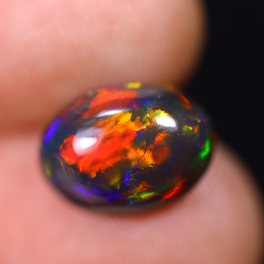 2.14Ct Welo Black Opal Polished - Ethiopian Opal , 448E: ThousandPlanet Auction Subject: Natural Ethiopian Welo Black Opal Origin: Ethiopia Carat Weight: 2.14Ct Dimension: 11.2x8.2x4.8 mm Treatment: Smoked Type: Cabochon, Polish