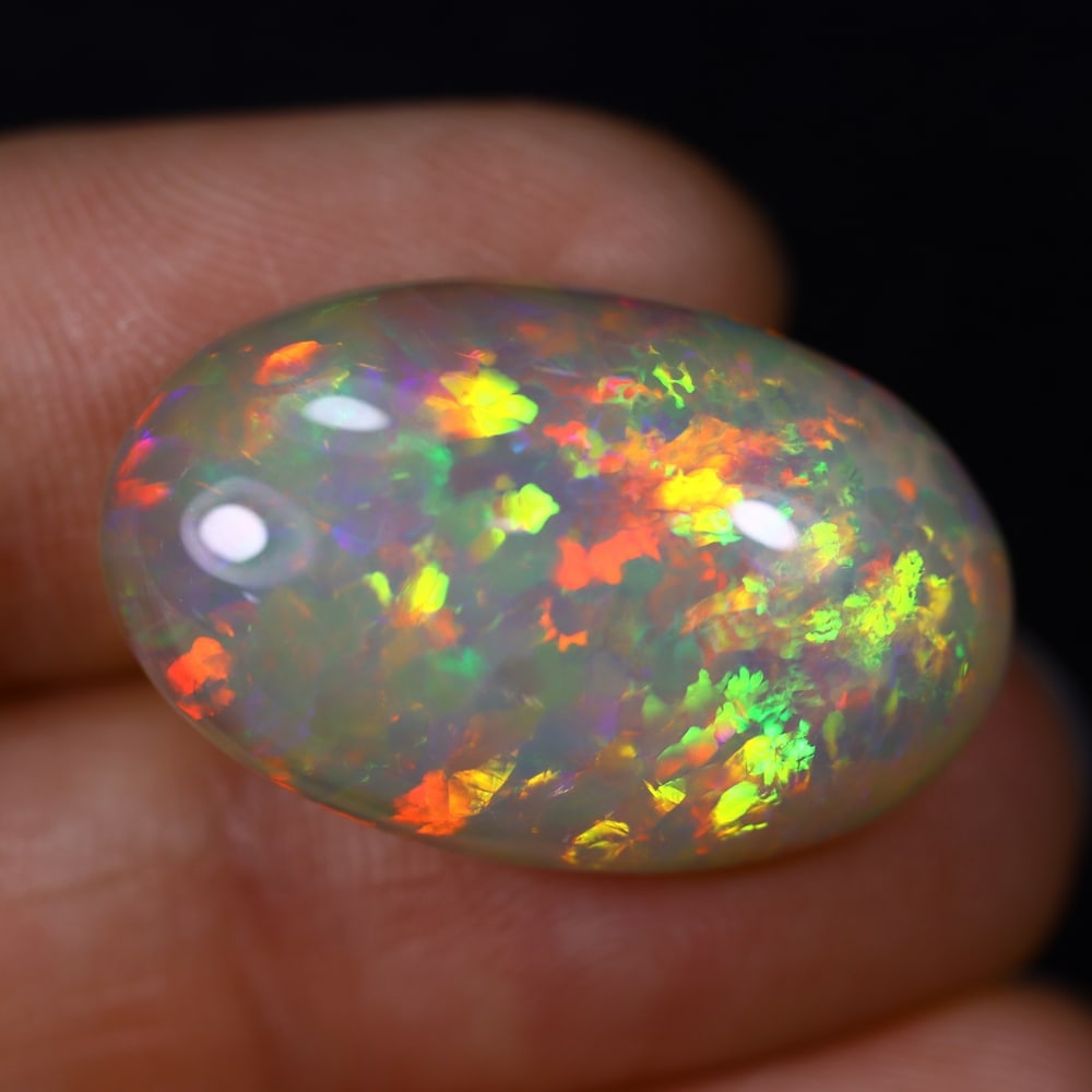 *16.97Ct Welo Opal Polished - Ethiopian Opal , 191C: ThousandPlanet Auction Subject: Natural Ethiopian Welo Opal Origin: Ethiopia Carat Weight: 16.97Ct Dimension: 25.1x15.8x7.7 mm Treatment: Natural Untreated Type: Cabochon,