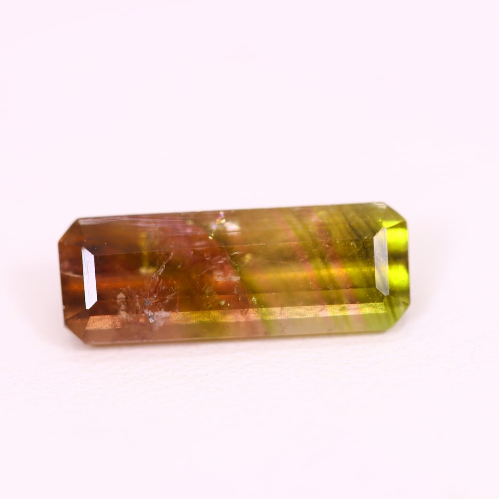 *3.13Ct Natural Watermelon Tourmaline - Bi-Colour Faceted Cut, 149C: ThousandPlanet Auction Subject: Natural Tourmaline Origin: Africa Carat Weight: 3.13 Ct Dimension: 14.8x5.4x4.3 mm Type: Faceted, Polished