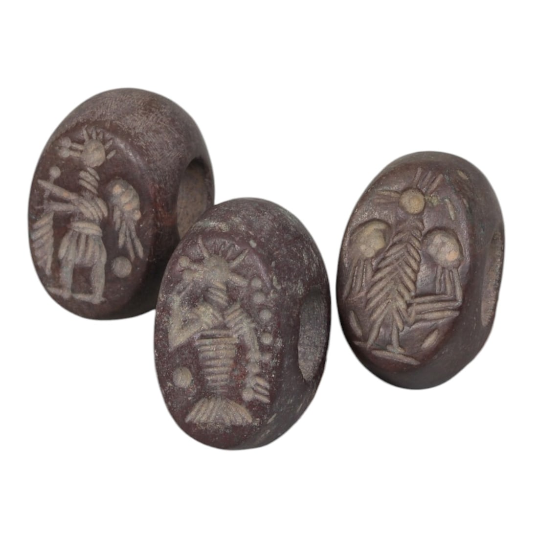 Lot of 3 Sasanian Stone Stamp Seals, Circa 3rd-7th Century CE, 14AG: Comprising three seals carved from dark reddish-brown stone with natural patina and surface wear consistent with age. Each seal is oval-shaped with a central perforation for suspension. The flat seali