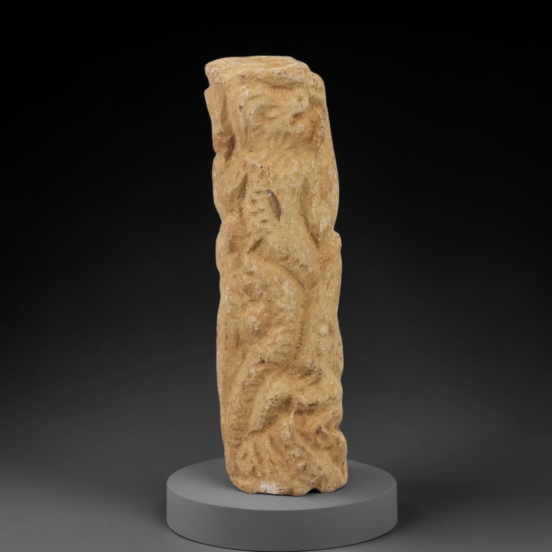 Ancient Limestone Cylinder Bead - Carved Relief Figurine, 8AH: Carved from limestone, this ancient cylinder bead features a slender, tubular form with raised relief detailing depicting a stylized humanoid figure, typical of ornamental use in early cultural contex