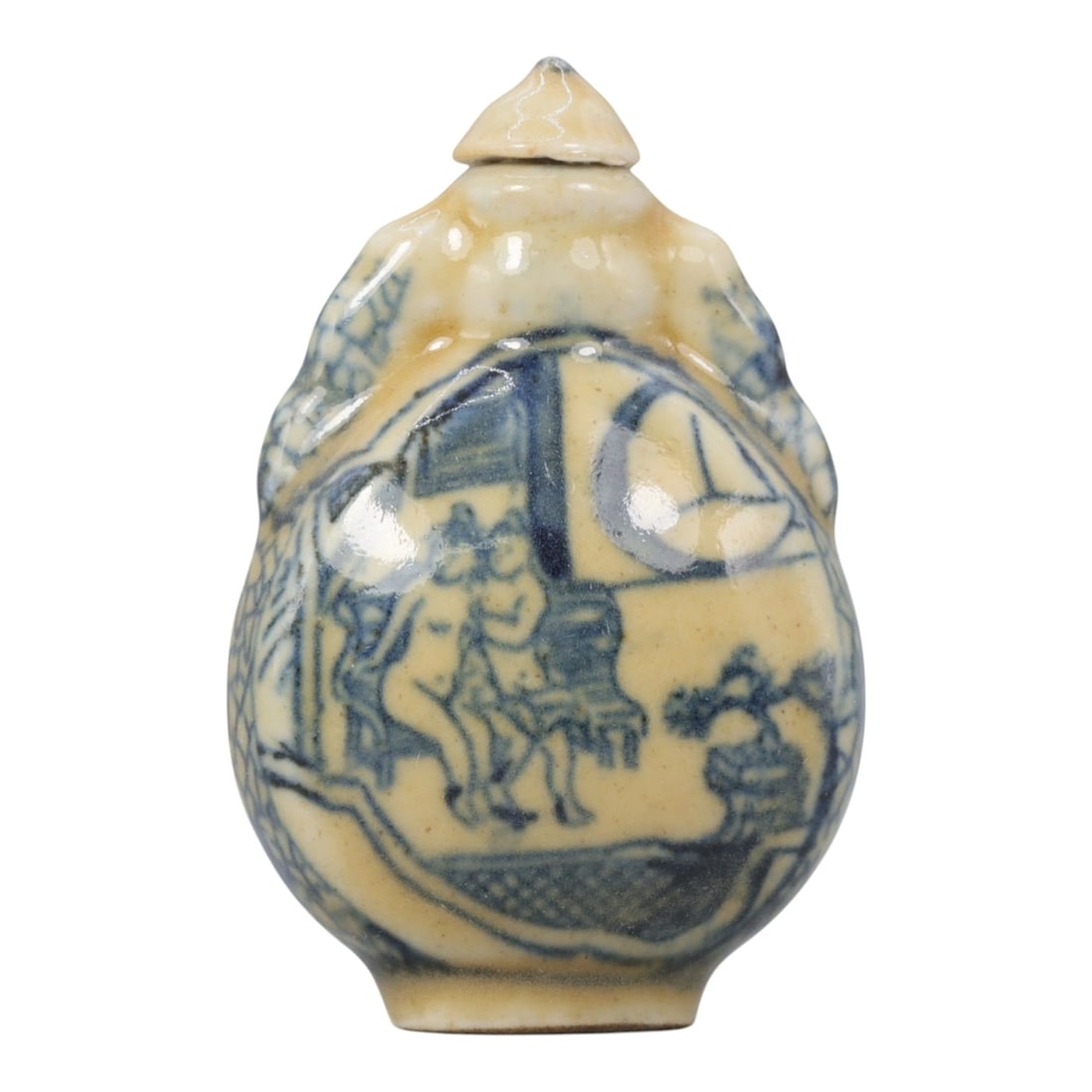 A Chinese Porcelain Snuff Bottle, 20th Century, 8YD: Crafted from porcelain with a pale cream glaze and decorated in underglaze blue, the snuff bottle features a rounded body with molded figural handles to either side, a short cylindrical neck, and a co