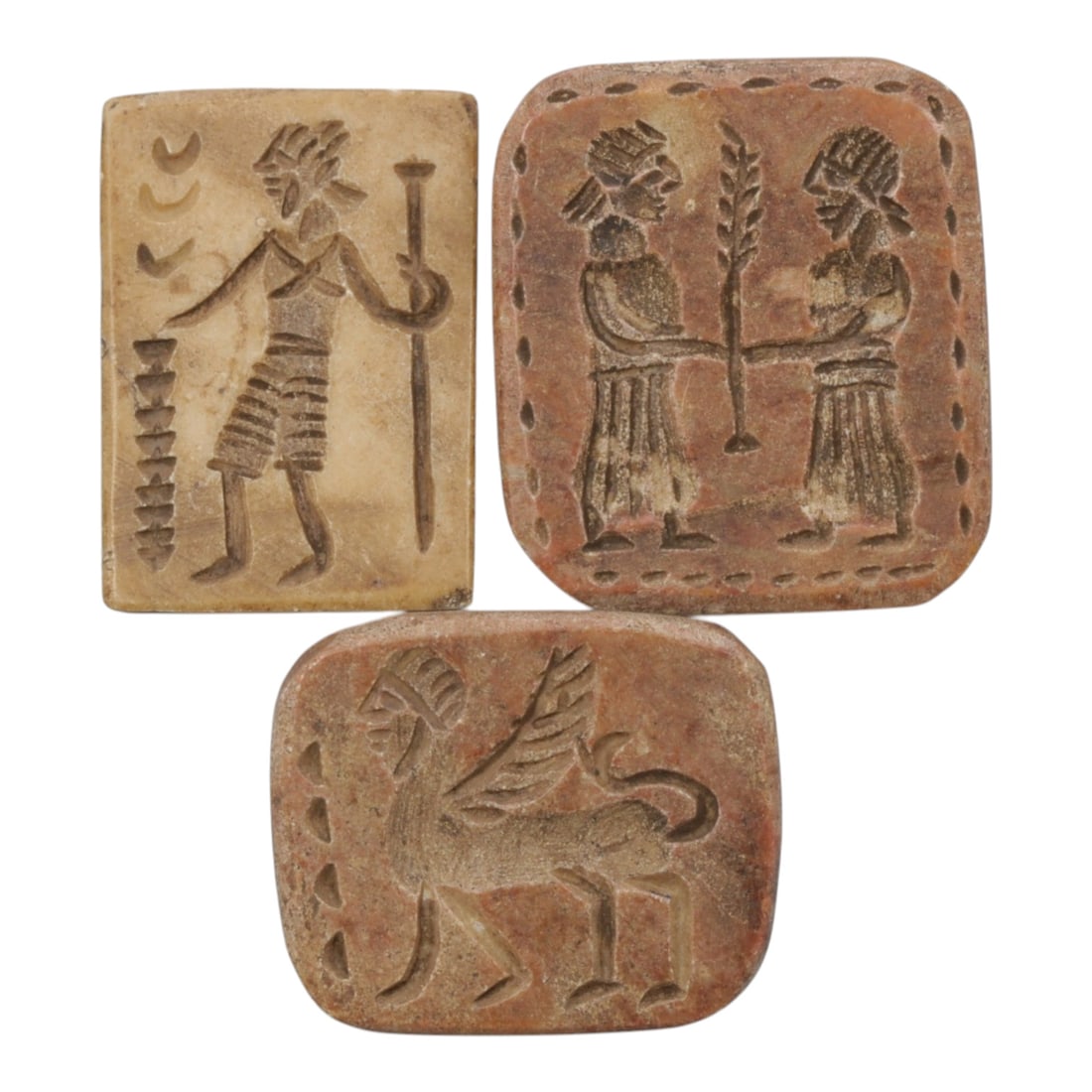 Lot of 3 Ancient Near Eastern Steatite Stamp Seals, Sasanian Period, 74WM: A group of three rectangular and rounded-corner stamp seals carved from steatite, in tones of light beige and reddish-brown with natural patination and surface wear consistent with age. Each seal feat