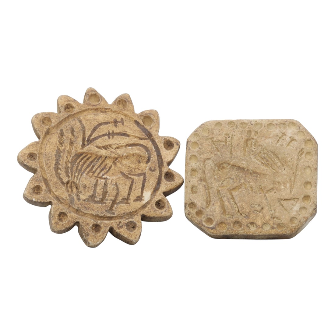 Lot of 2 Ancient Near Eastern Steatite Stamp Seals, Sasanian Period, 70WM: A group of two steatite stamp seals from the Sasanian period, varying in form: one sun-shaped with a scalloped, dot-patterned border, the other octagonal with a similarly decorated edge. Both are carv