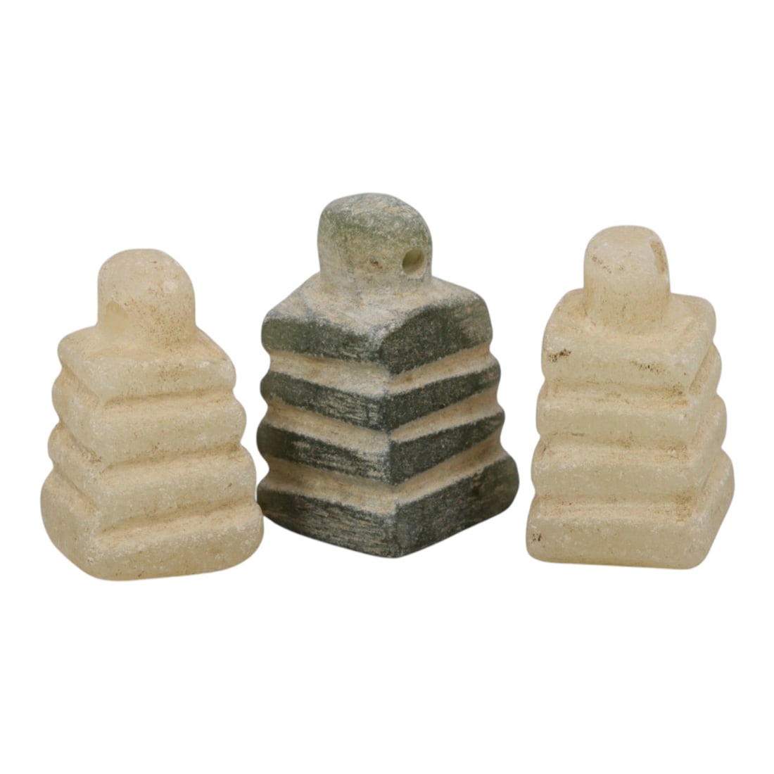 Lot of 3 Ancient Egyptian Stone Amulets, Late Period to Ptolemaic Period, 93WM: A collection of three ancient Egyptian stone amulets, carved from light-colored and greenish stone in the form of tiered stepped structures, likely representing a djed pillar or related symbolic motif
