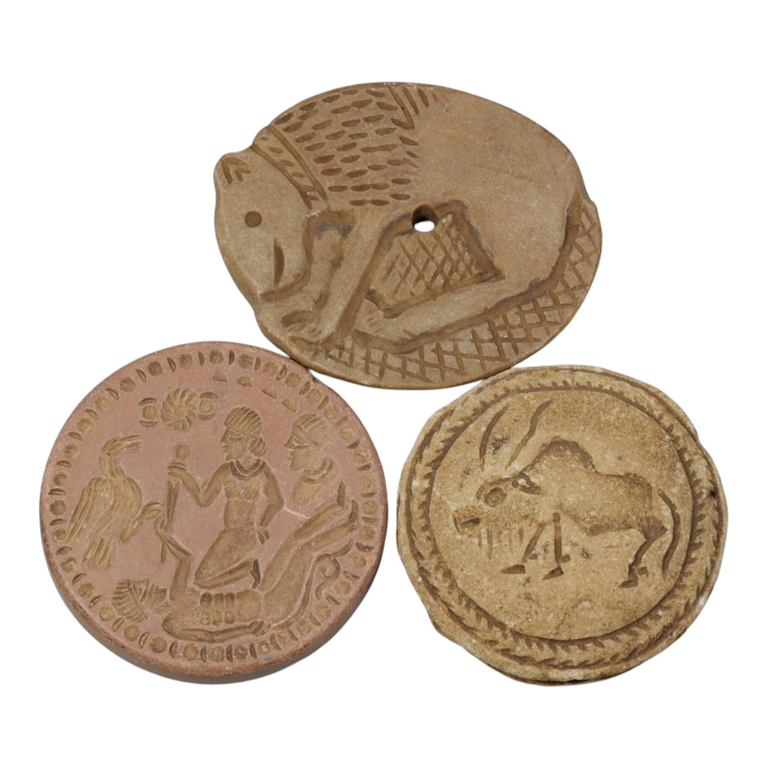 Lot of 3 Ancient Near Eastern Style Stone Disc Seals / Amulets, 7WT: A curated lot of three ancient Near Eastern-style disc-shaped stone seals/amulets, with natural patination and wear consistent with age. The collection features varied iconography: one depicts a styli