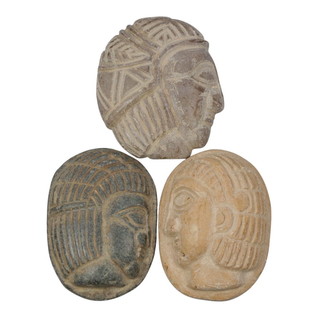 Lot of 3 Ancient Coptic Egyptian Stone Face Beads / Amulets, Circa Roman to Coptic Era, 100WM: A curated lot of three ancient Coptic Egyptian-style amulets, carved from stone with varied natural hues and patination consistent with age. Each flat-backed oval piece features a stylized profile fac