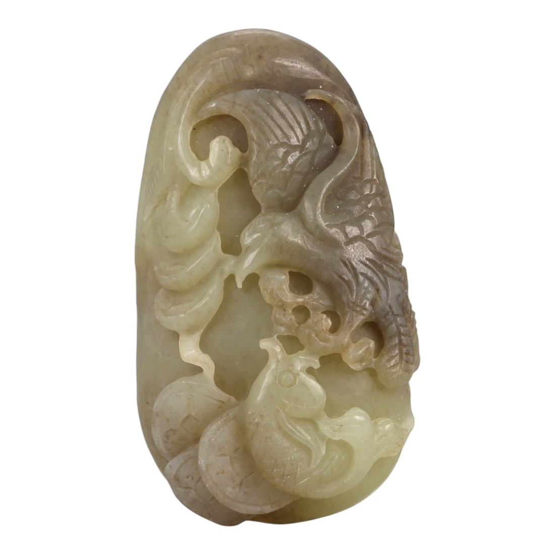 A Chinese Nephrite Jade Relief Plaque, 20th Century, 77YA: Carved from pale celadon Hetian nephrite jade with areas of lighter translucency and natural inclusions, the plaque is worked in openwork relief depicting intertwined zoomorphic and avian forms. One f