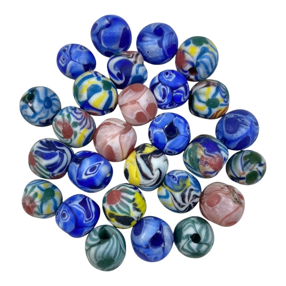 A Lot of 27 Vintage Handmade Swirled Glass Beads, 84AA: This collection features 27 vintage glass beads, showcasing classic lampwork and swirled glass techniques. The set is dominated by vibrant blue and white beads, accented with pink, green, yellow, and 