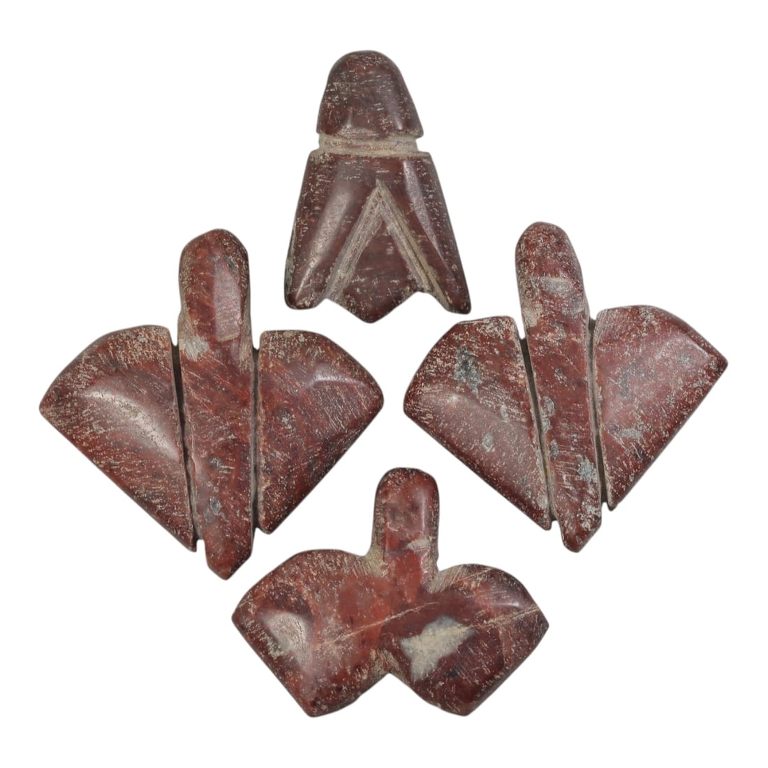 Lot of 4 Ancient Coptic Egyptian Red Stone Fly Amulets, Circa Roman to Coptic Era, 37AE: Carved from deep red stone with a polished surface and light surface encrustation, each amulet is formed in the stylized shape of a fly, a motif associated with protection and rebirth in Egyptian and 
