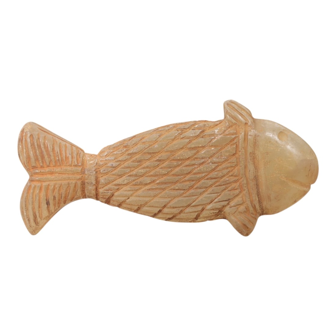 Ancient Chalcedony Fish - Near Eastern Amulet Figurine, 4AL: Carved from translucent chalcedony, this amulet depicts a stylized fish form with incised linear details defining the scales, fins, tail, and facial features, including a defined eye and mouth. Attrib