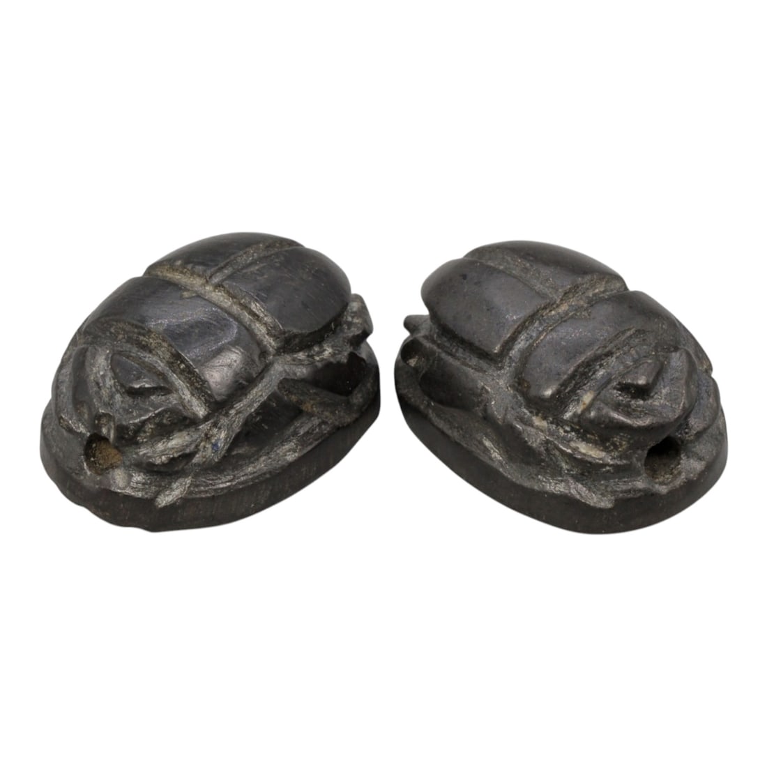 Lot of 2 Ancient Coptic Egyptian Dark Stone Scarabs, Circa Roman to Coptic Era, 85WL: Each scarab is carved from a dark grey to black stone, with a smooth surface and subtle natural patination consistent with age. Both are rendered in the traditional scarab form, with incised lines def