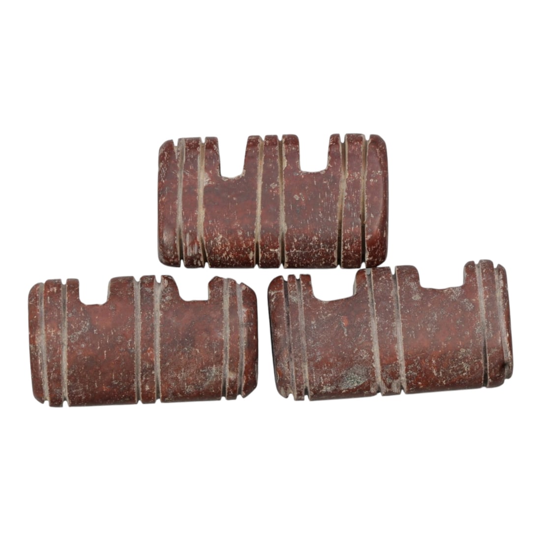 Lot of 3 Islamic Period Jasper Amulets, Circa Medieval Period, 54WL: A group of three hand-carved amulets attributed to the Islamic medieval period, crafted from rich red jasper stone, exhibiting deep earthy tones alongside surface patination, wear, and subtle weatheri