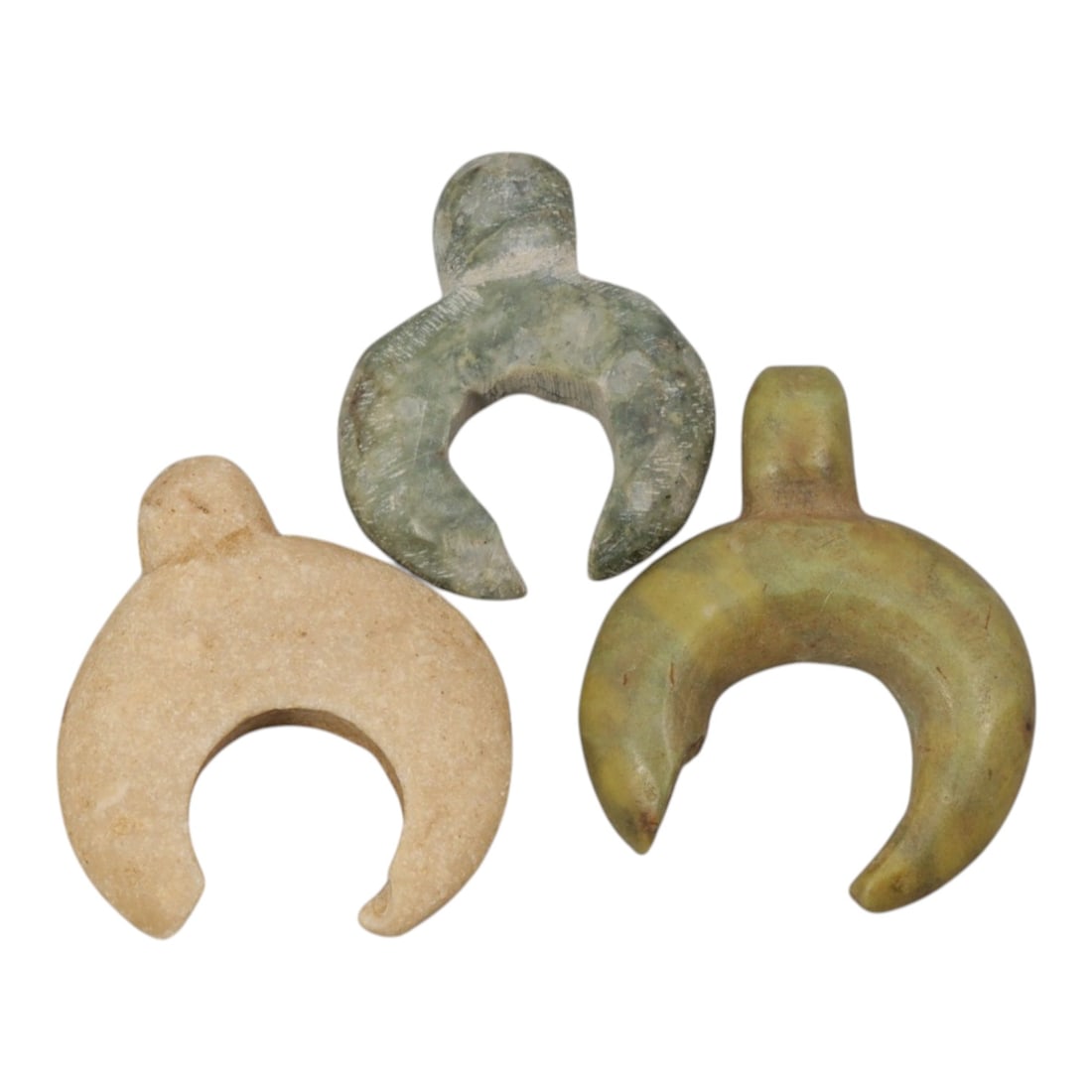 Lot of 3 Ancient Coptic Egyptian Stone Lunar Amulets, Circa Roman to Coptic Era, 38WL: A group of three crescent-shaped amulets carved from stone, characteristic of protective lunar symbolism in Roman to Coptic period Egypt. Each example features a suspension loop for wear as a pendant,