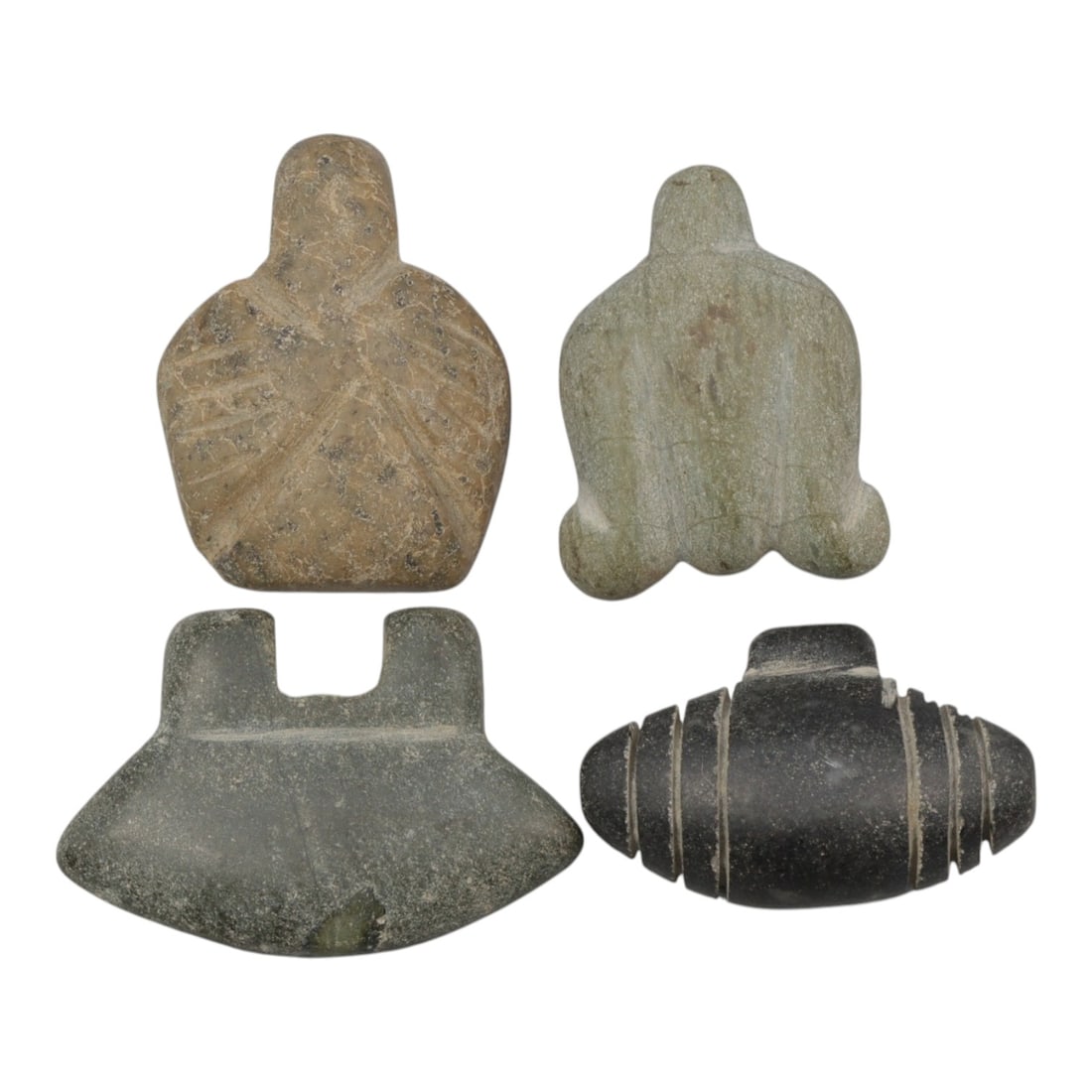 Lot of 4 Coptic Egyptian Stone Amulets, Roman to Coptic Period, 11AE: A group of four stone amulets from the Roman Period to Coptic Era in Egypt, each carved from different colored stone including light green, dark grey, black, and brownish tones. The forms are varied: 