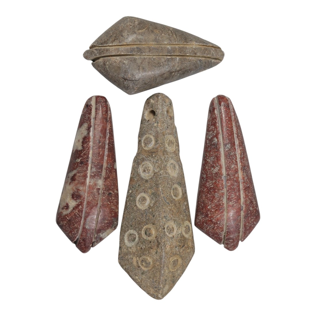 Lot of 4 Achaemenid Period Stone Amulets, Circa 5th-4th Century BCE, 71AE: The group comprises four carved stone amulets of conical and leaf-shaped forms, characteristic of the Achaemenid period. Three examples are worked in reddish-brown stone with central incised lines def