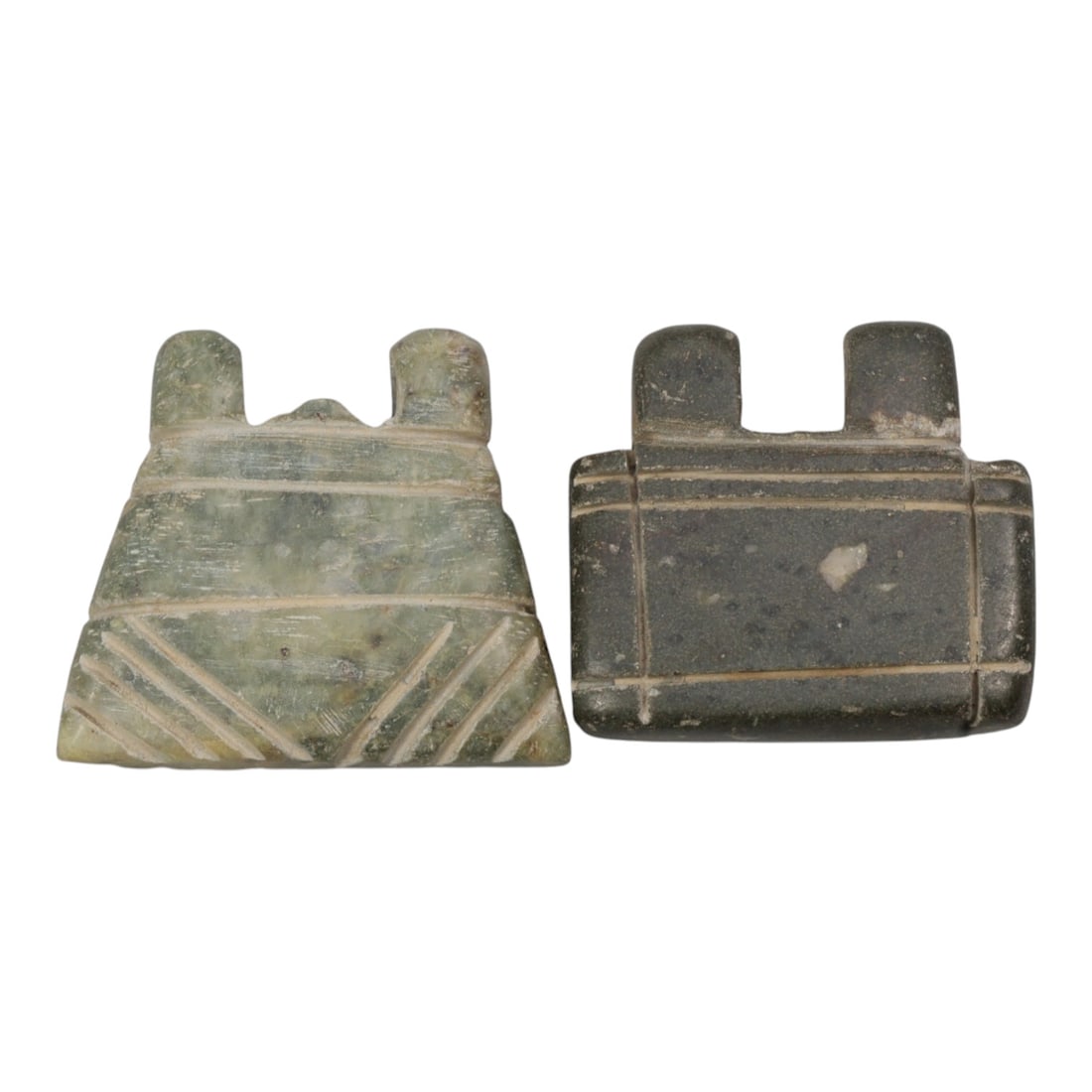 Lot of 2 Islamic Period Stone Amulets, Circa Medieval Period, 65WL: A pair of hand-carved amulets attributed to the Islamic medieval period, crafted from natural stone in two distinct tones: light greenish and dark grey, both exhibiting surface patination, wear, and s