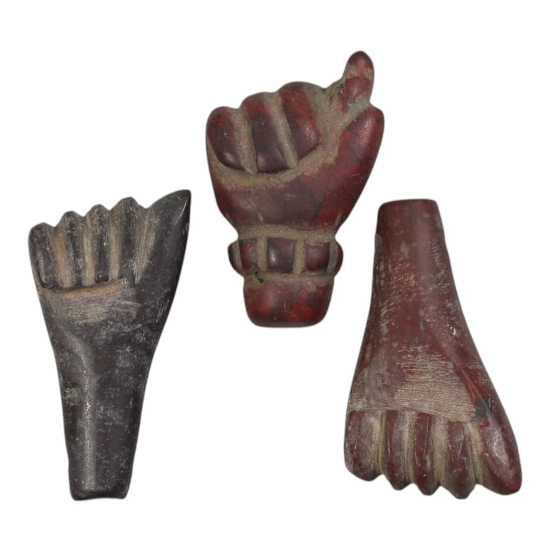 Lot of 3 Ancient Egyptian Stone Fist/Hand Amulets, Circa Late Period to Coptic Era, 44AE: The group comprises three carved stone amulets depicting hands or fists, characteristic of Egyptian protective iconography from the Late Period through the Coptic era. The pieces are worked in varied 