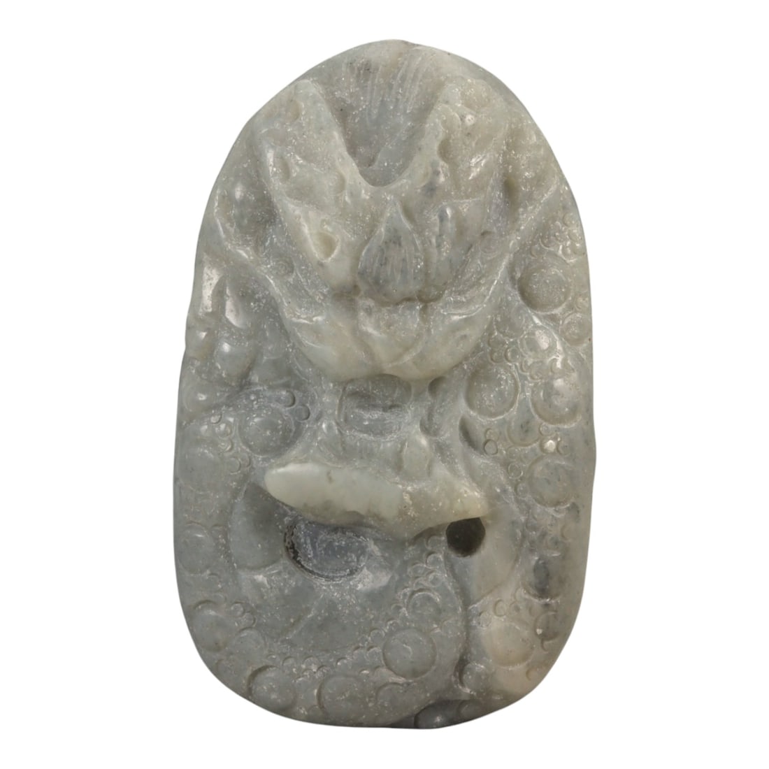 A Chinese Nephrite Jade Dragon Pendant, 20th Century, 38FB: Carved from pale grey-green nephrite jade with areas of translucency and scattered natural inclusions, the pendant is worked in an upright oval form. The surface is carved in relief with a frontal dra