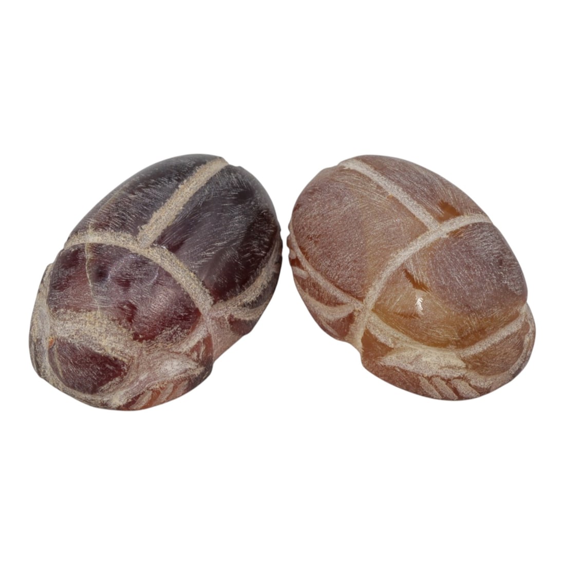Lot of 2 Ancient Coptic Egyptian Carnelian Scarabs, Circa Roman to Coptic Era, 2WL: The group comprises two scarab amulets carved from reddish-brown carnelian stone. Each is rendered in the traditional scarab form, with incised lines defining the carapace, elytra, and head details. T