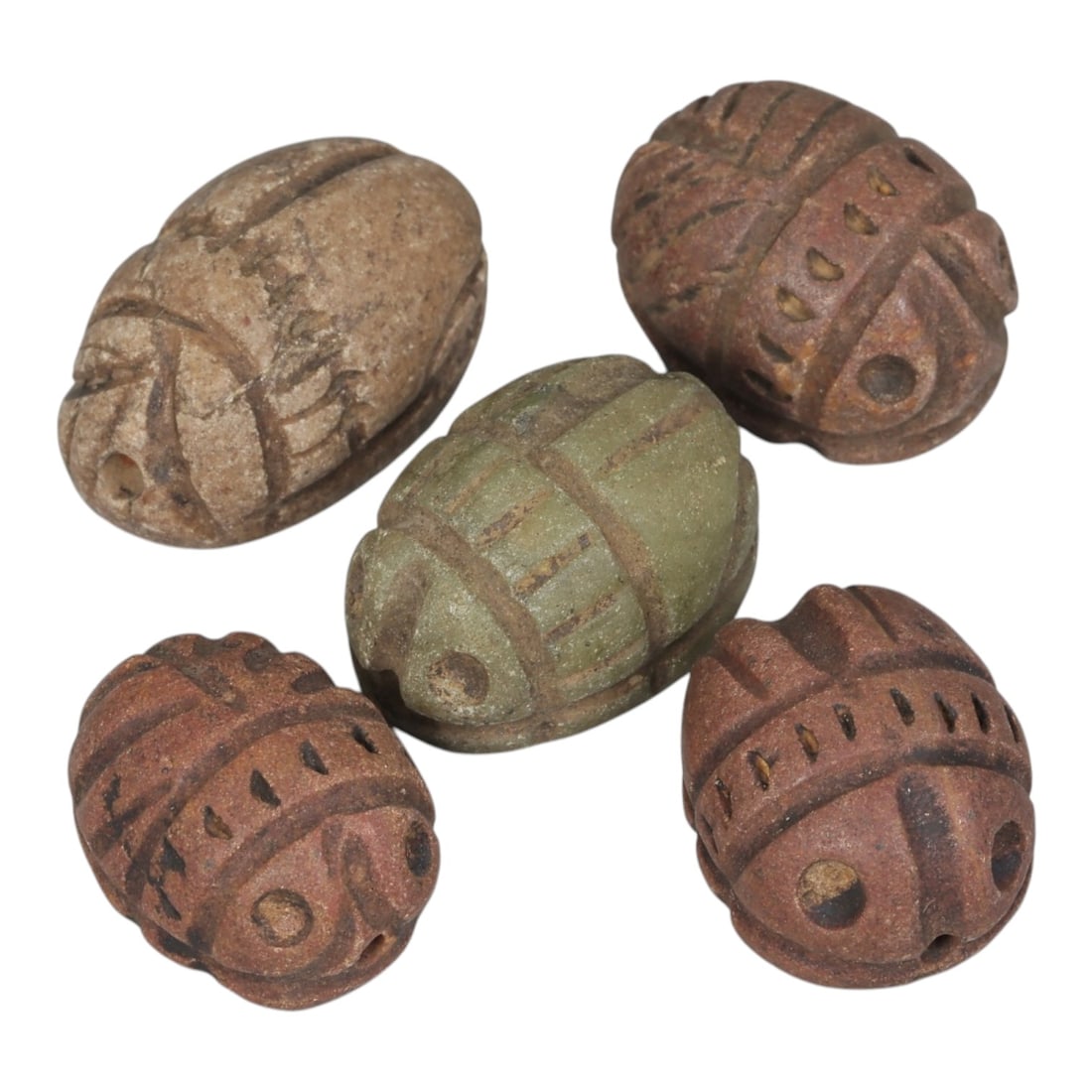 Lot of 5 Ancient Coptic Egyptian Stone Scarabs, Circa Roman to Coptic Era, 54AE: The group comprises five scarab amulets carved from stone in varying tones of light brown, reddish-brown, and green. Each is rendered in the traditional scarab form, with incised lines defining the ca