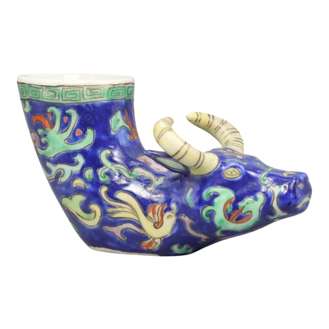 A Chinese Porcelain Bovine-Form Vessel, 20th Century, 85YC: Modeled in porcelain, the vessel is formed as a recumbent bovine with the head turned slightly to one side and the body hollowed to create an open container rising from the back. The animal is depicte