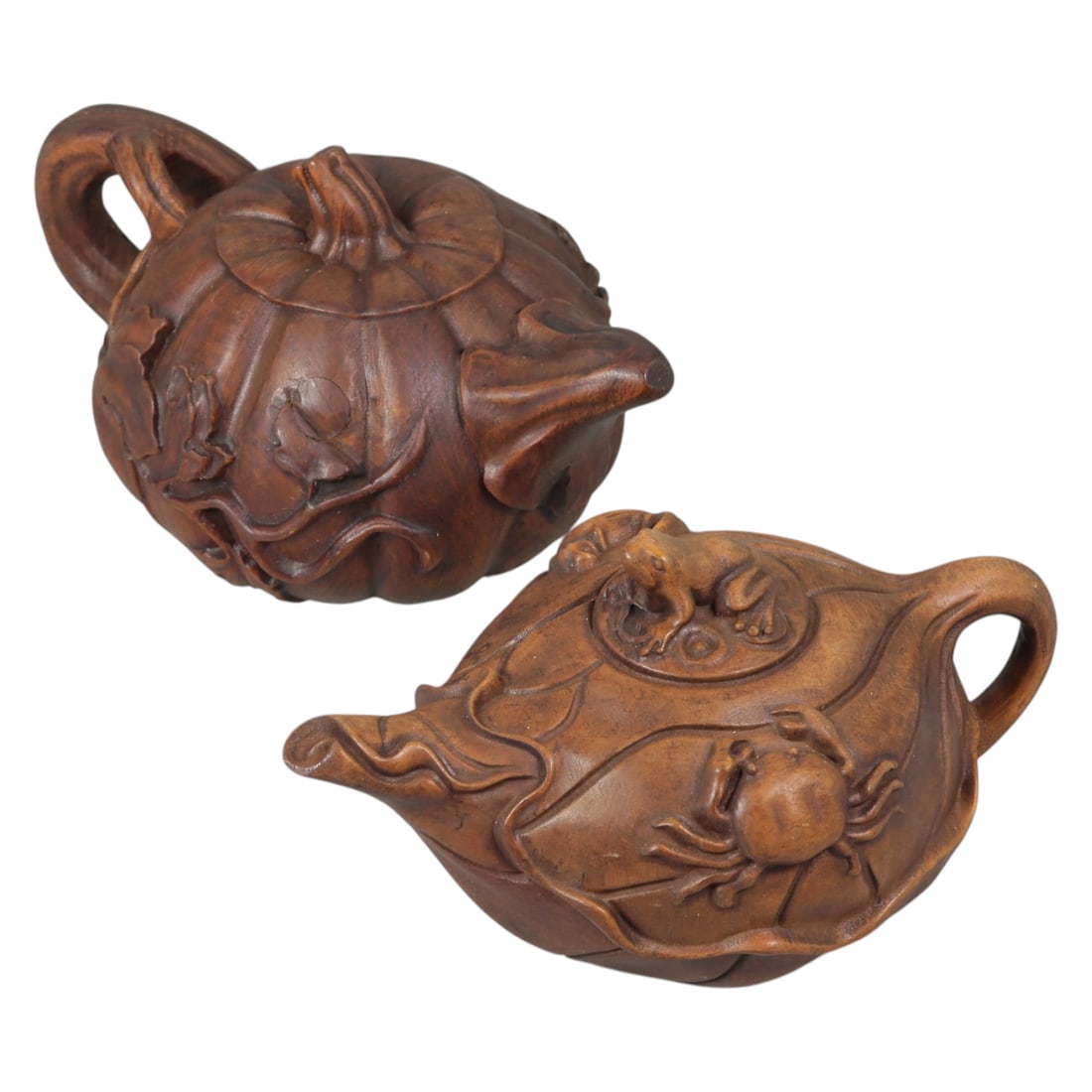 Lot of 2 Vintage Oriental Chinese Carved Wood Teapots, 66AG: Carved from solid wood with a rich, warm brown patina, the two teapots are each modeled in naturalistic forms. The first teapot is shaped as a pumpkin, with vertical fluting mimicking the segmented ri