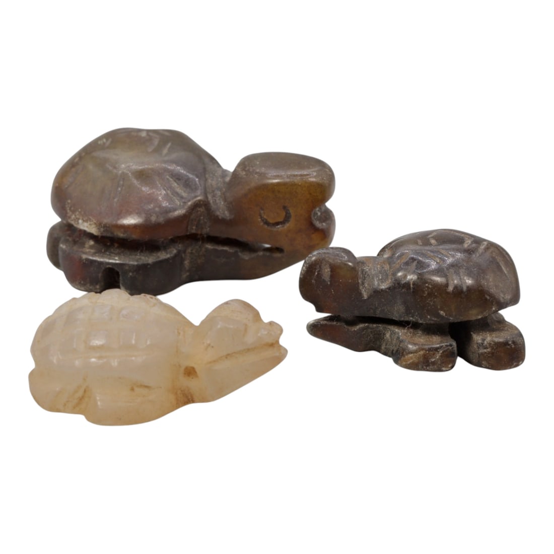 Lot of 3 Antique Chinese Qing Dynasty Jade Tortoise Carvings, 17WM: A group of three hand-carved jade tortoise figures, typical of Qing Dynasty jade craftsmanship. The tortoises are rendered in recumbent poses with stylized incised lines representing the shell pattern