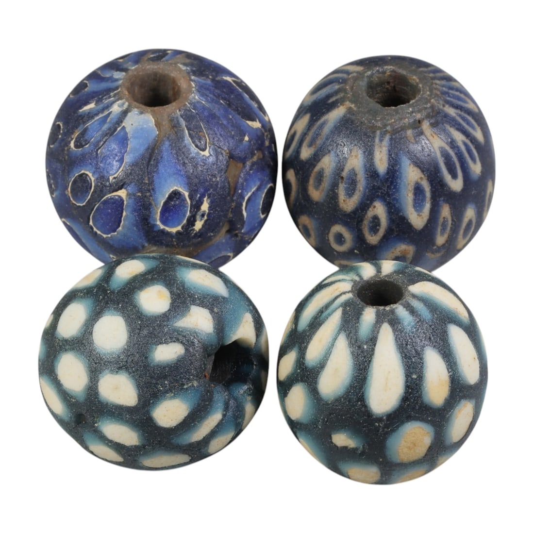 Lot of 4 Ancient to Antique Polychrome Glass Beads, 1st Mil BCE to Islamic Period, 38WM: A group of four spherical polychrome glass beads, each with a central perforation. The beads feature intricate mosaic and millefiori-style decoration, including eye motifs, dot patterns, and composite