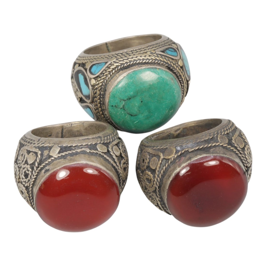 Lot of 3 Vintage Central Asian Tribal Silver Gemstone Rings, 54AD: A collection of three vintage tribal-style rings, characteristic of Central Asian folk jewelry traditions. Each ring is crafted from silver-toned metal with an aged patina, showcasing traditional twis