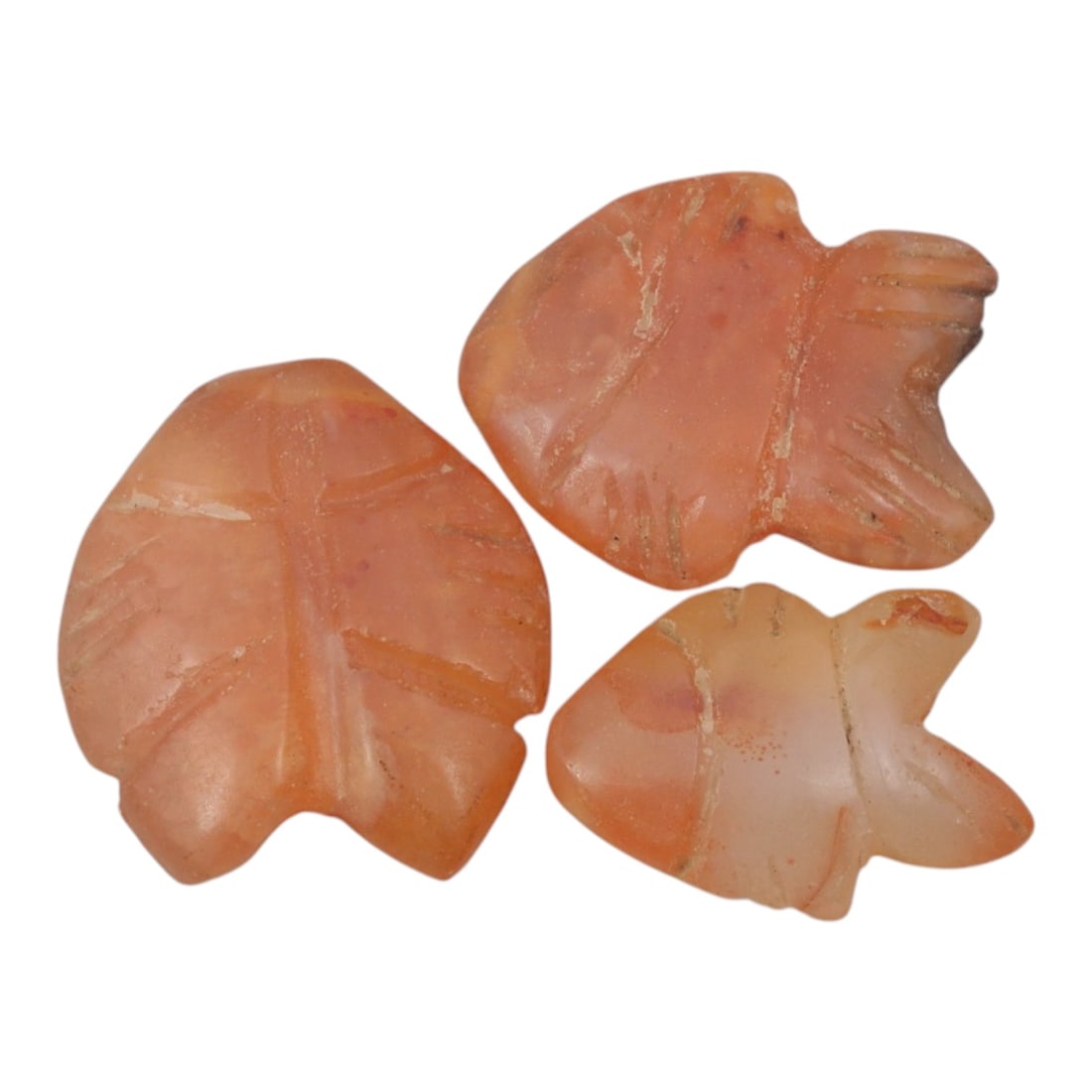 Lot of 3 Ancient Coptic Egyptian Carnelian Zoomorphic Amulets, c. Roman Period to Coptic Era, 24WL: Carved from warm, translucent carnelian with natural orange-red hues and subtle weathering, this set includes three stylized zoomorphic amulets, likely representing fish or avian forms, each with inci