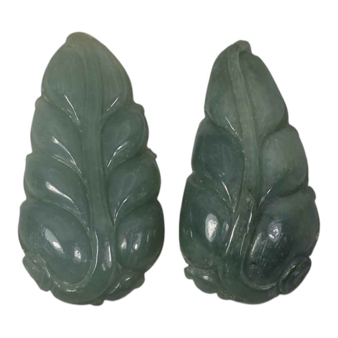 Lot of 2 Antique Oriental Chinese Jadeite Jade Leaf Pendants, 28AG: Carved from translucent muted green jadeite jade with subtle natural tonal variations, each pendant is shaped as a stylized leaf with a raised central vein and recessed lateral leaf segments. The surf