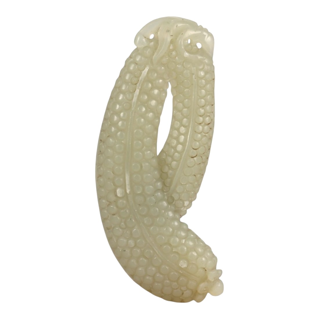 A Chinese Nephrite Jade Fruit Pendant, 20th Century, 64FA: Carved from pale celadon nephrite jade with soft translucency and scattered natural inclusions, the object is formed as a stylized fruit cluster composed of two elongated, gently curving lobes joined 