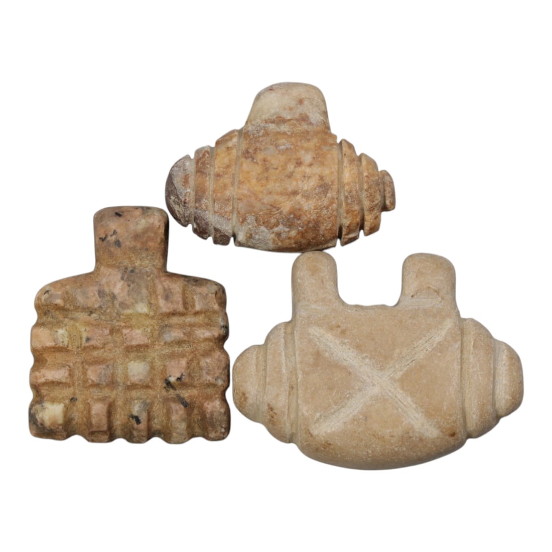 Lot of 3 Islamic Period Steatite Amulets, Circa Medieval Period, 63WL: A group of three hand-carved amulets attributed to the Islamic medieval period, crafted from warm beige and light brown steatite stone, exhibiting natural earthy tones alongside surface patination, we