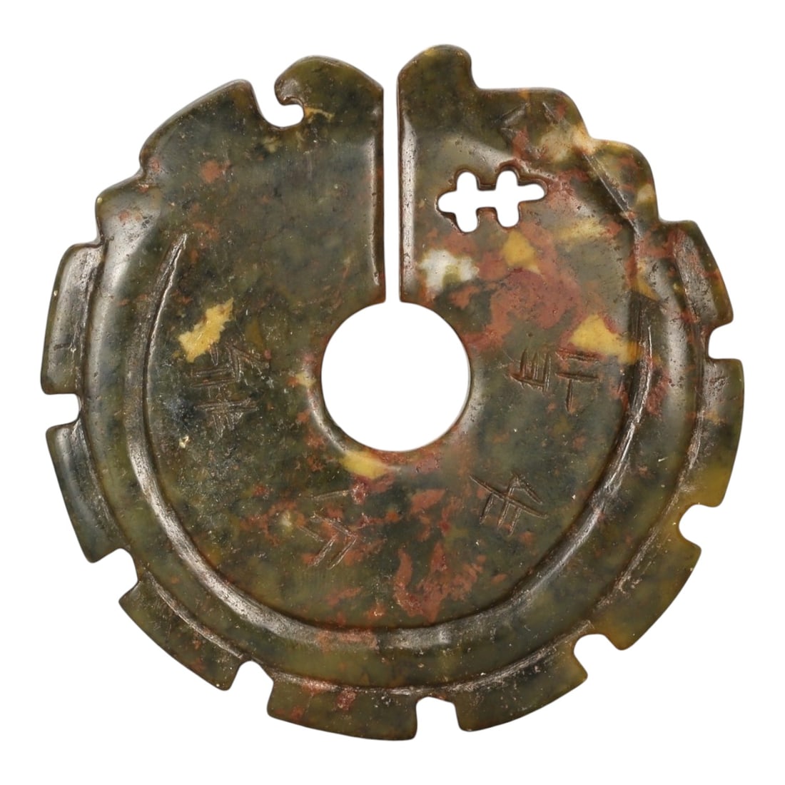 A Chinese Hardstone Bi-Form Disc, Possibly Late Qing to Early Republic Period, 86FC: Carved from mottled hardstone of olive-green, russet, and ochre tones with natural inclusions and surface variation, the object is worked as a circular disc with a central circular aperture, recalling