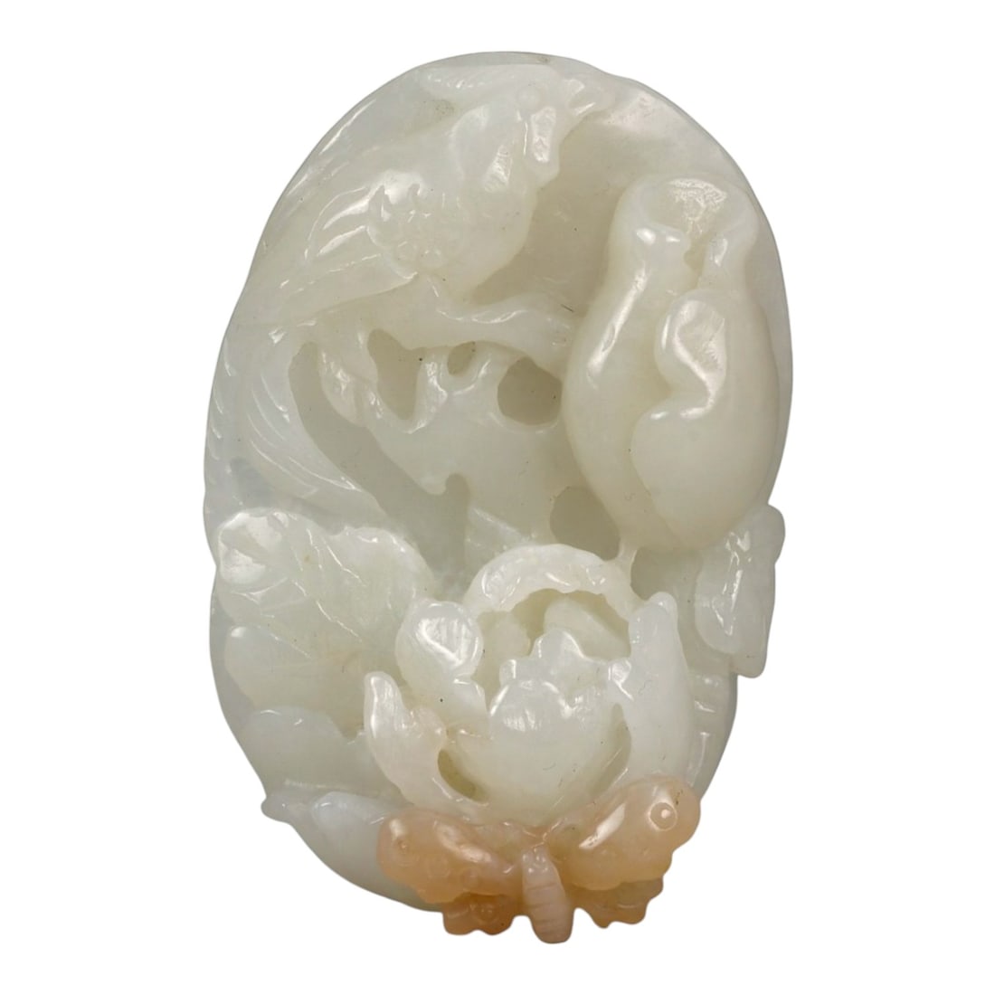 A Chinese Nephrite Jade Figural Pendant, 20th Century, 48FB: Carved from pale white nephrite jade with soft translucency and minor natural inclusions, the pendant is worked in relief with a compact figural composition. The design depicts a grouping of animals, 