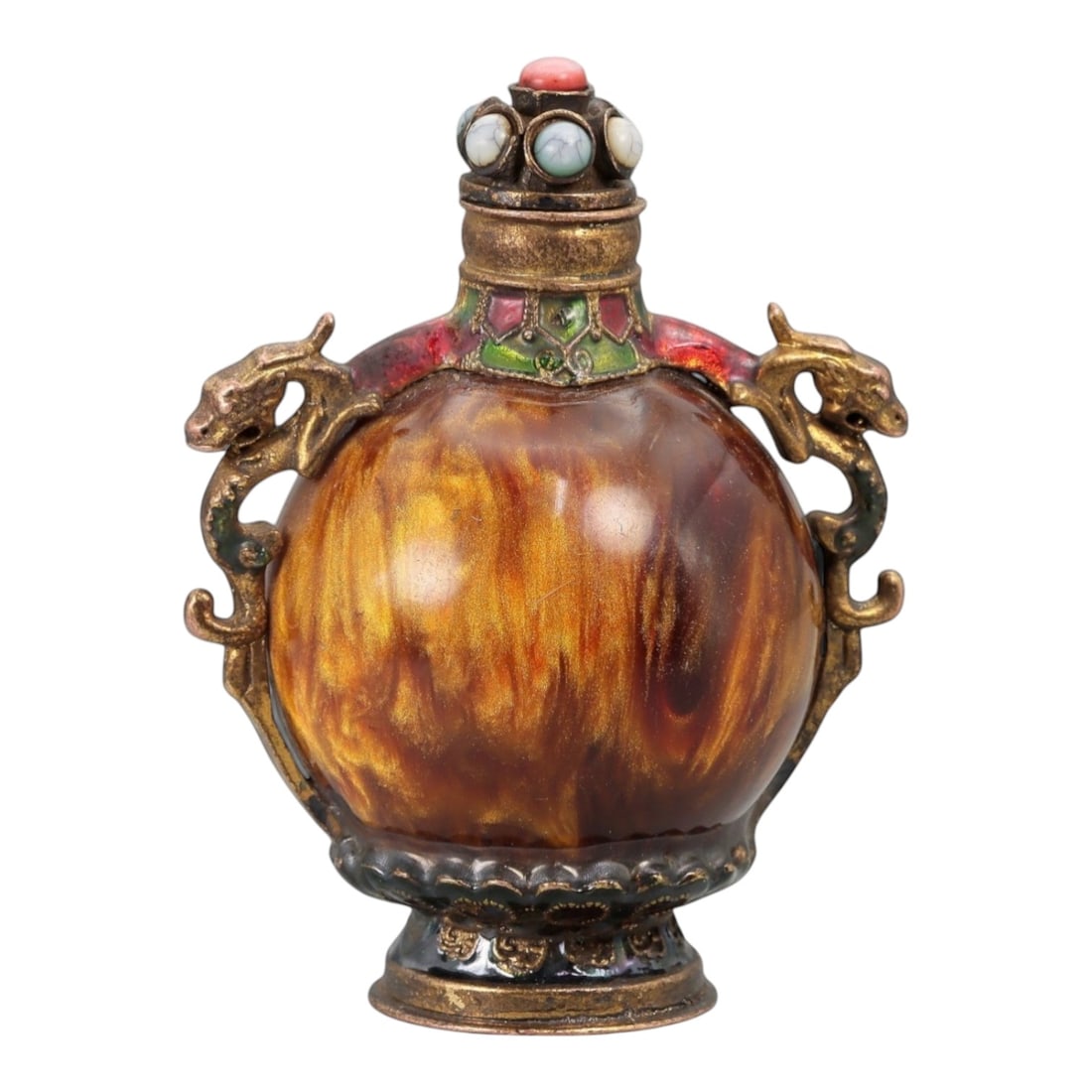 A Chinese Resin and Brass Snuff Bottle, 20th Century, 20FG: The bottle is formed with a rounded ovoid body composed of translucent amber-toned resin, exhibiting swirling internal striations and tonal variation intended to simulate organic material. The body is