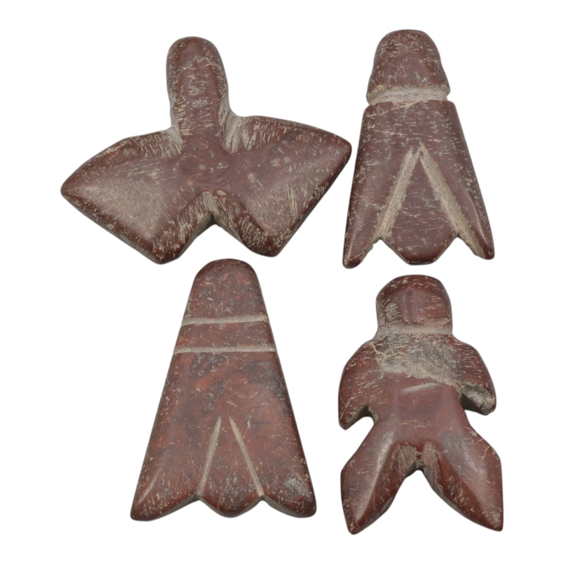 Lot of 4 Ancient Coptic Egyptian Red Stone Fly Amulets, Circa Roman to Coptic Era, 9AE: Comprising four carved red stone fly amulets ranging from 2.5 cm to 3 cm, these pieces are characteristic protective talismans from the Coptic Egyptian period. Each is rendered in smooth, deep red sto