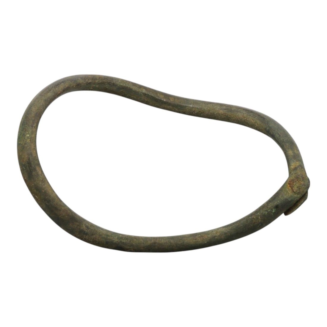 Ancient Bronze Anklet - Roman Penannular Bangle, 82BN: A penannular bronze anklet of ancient Roman origin, formed from a slender, rounded bronze band. The piece features a simple folded terminal closure at one end, characteristic of Roman provincial jewel