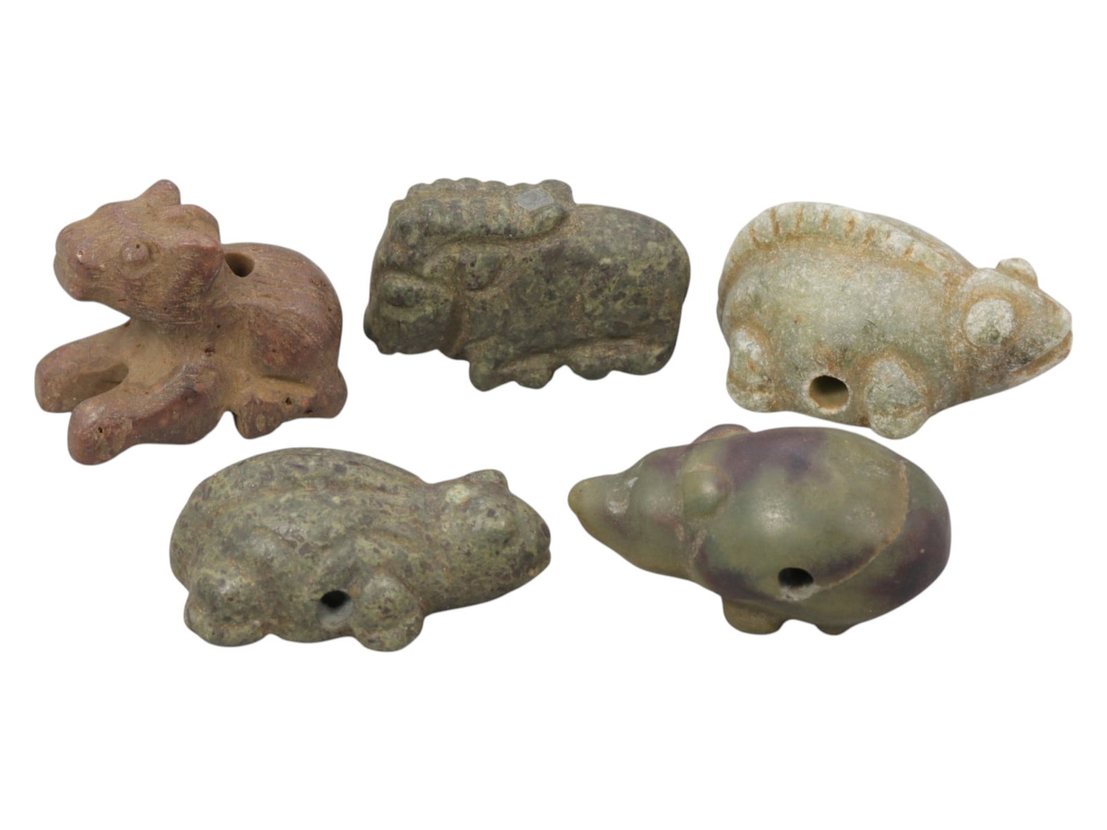 Lot of 5 Ancient Near Eastern Zoomorphic Stone Amulets, c. Iron Age to Sasanian Period, 87WK: A curated collection of five zoomorphic stone amulets from the Ancient Near East, carved from varied materials including brown, green, and variegated stone. The set features stylized recumbent animals